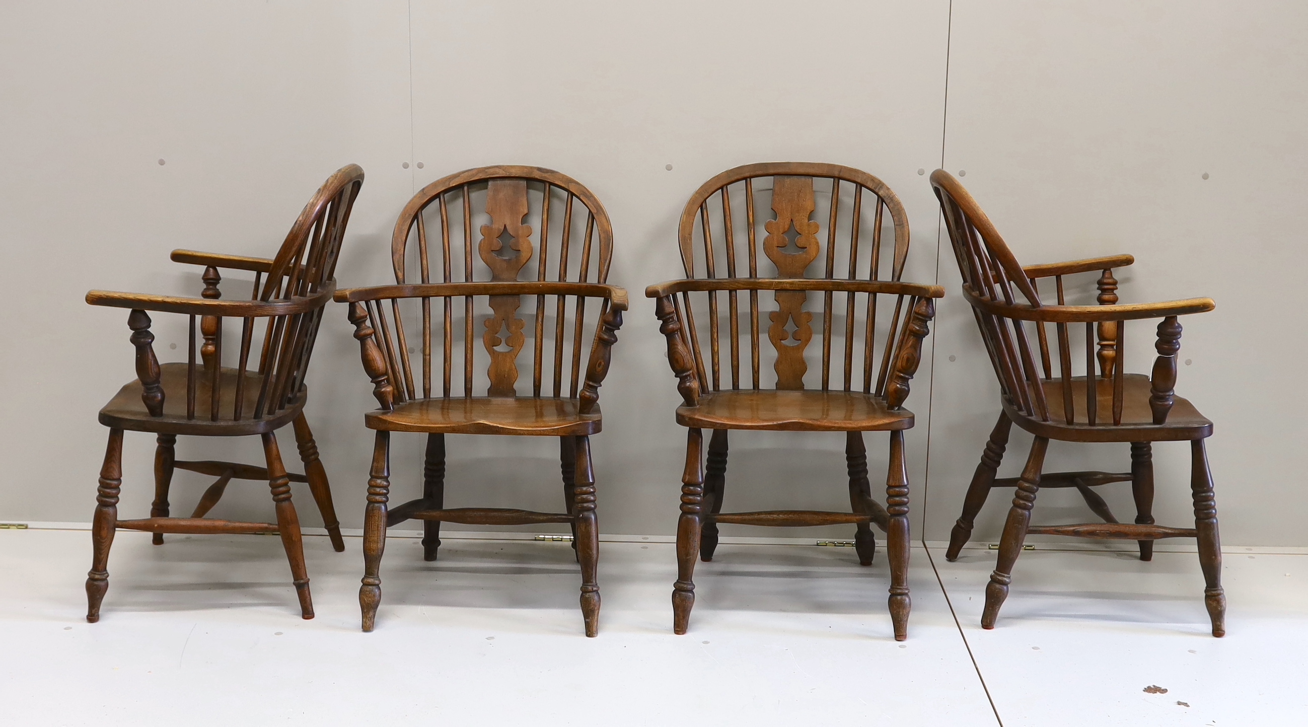 A near set of four 19th century Nottingham area elm, ash and beech Windsor elbow chairs, possibly by Allsop & Son, width 58cm, depth 39cm, height 94cm